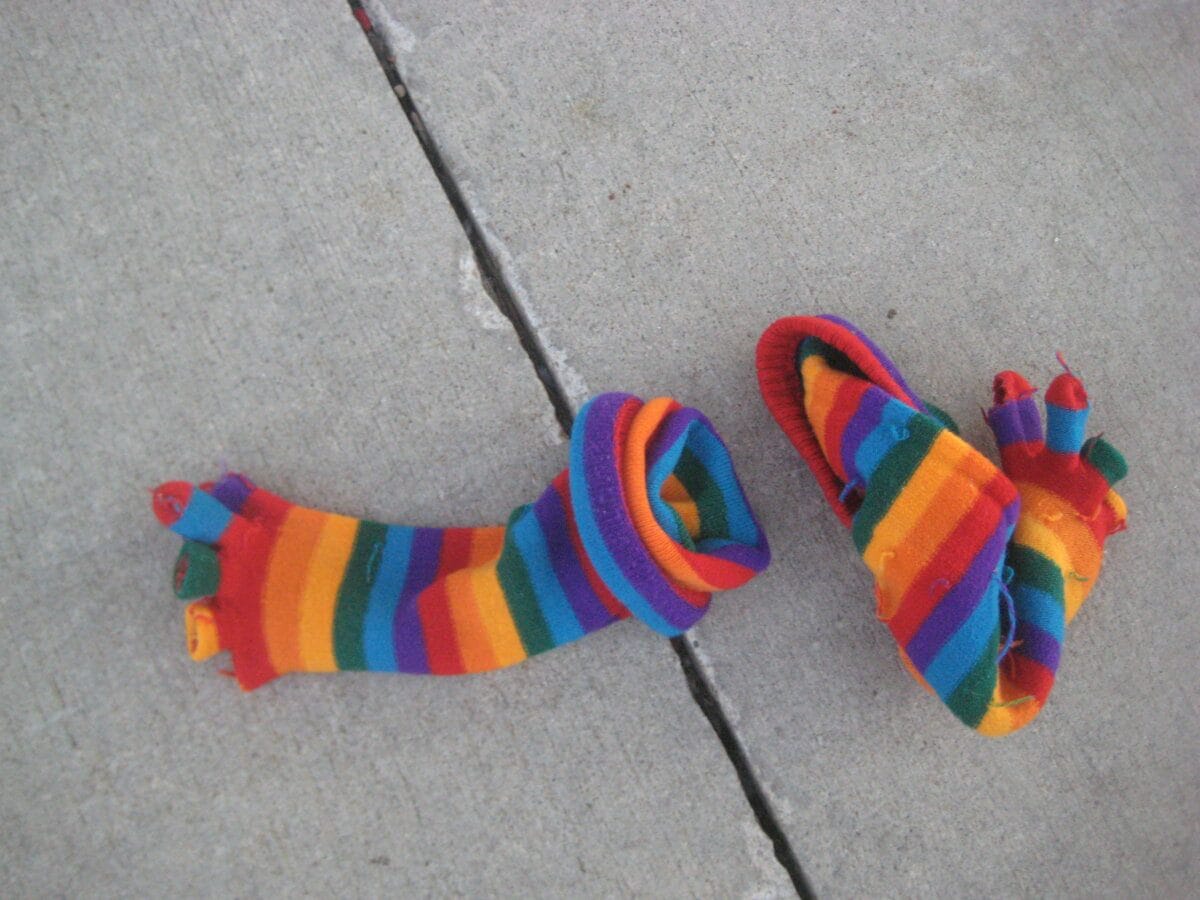 Colorful toe socks on pavement