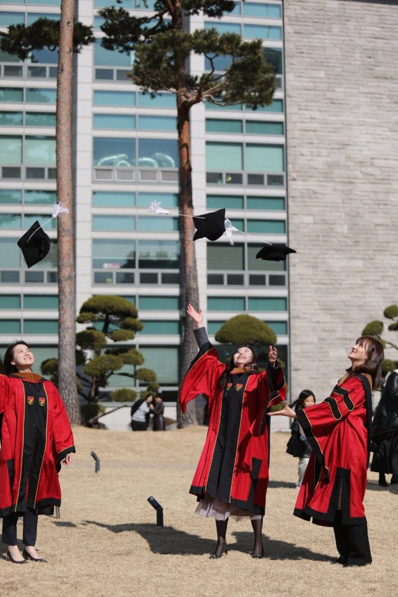 Korean university students at a graduation ceremony, representative of the Gen Z demographic behind the trend keywords