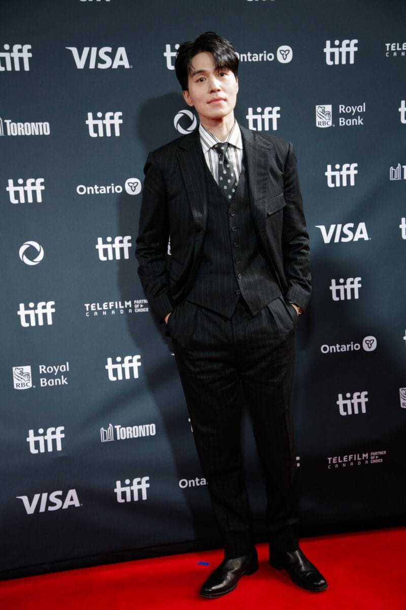 Lee Dong-wook posing at a film festival red carpet