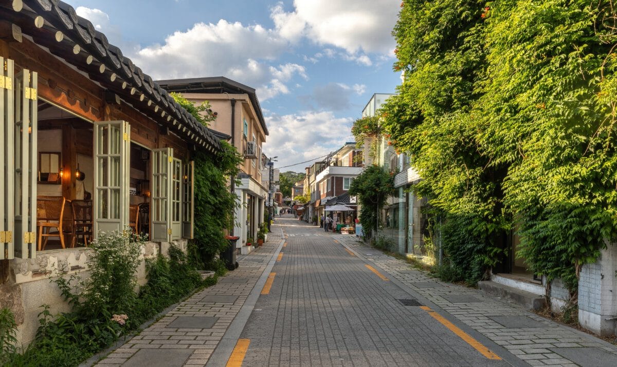 A quiet residential street in Seoul at golden hour