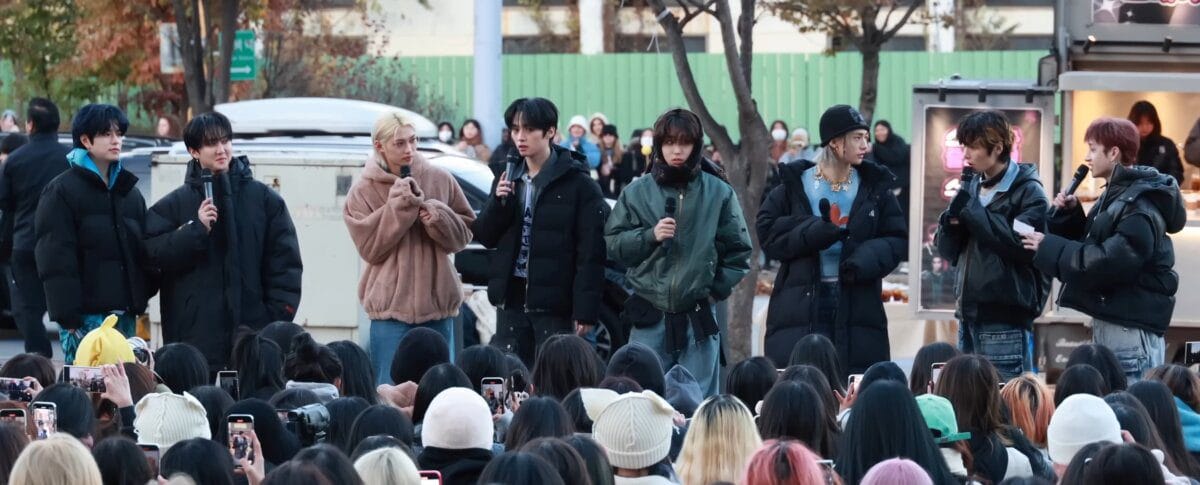 Stray Kids members at a fan meeting event