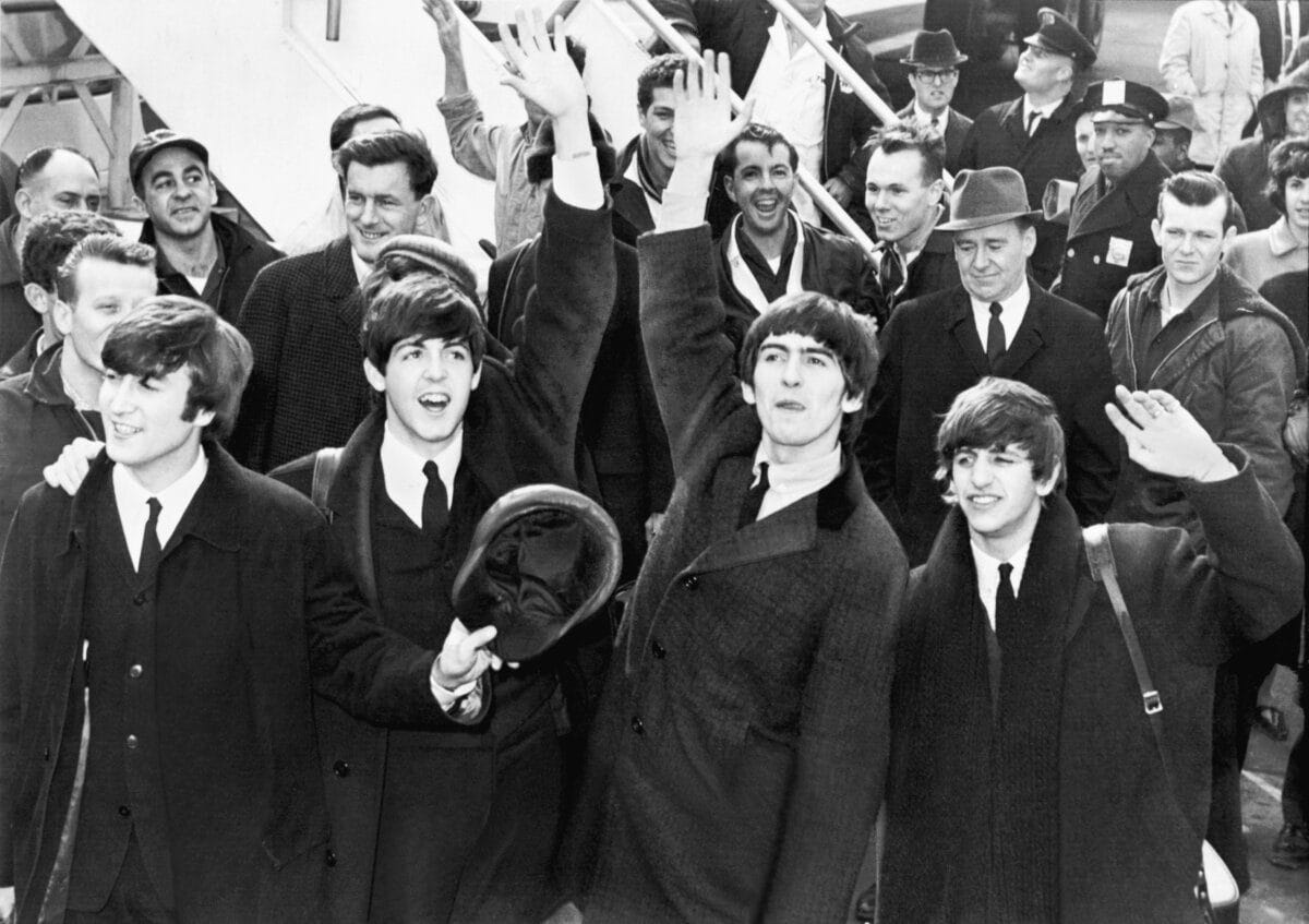 The Beatles arriving and giving a press conference in the 1960s