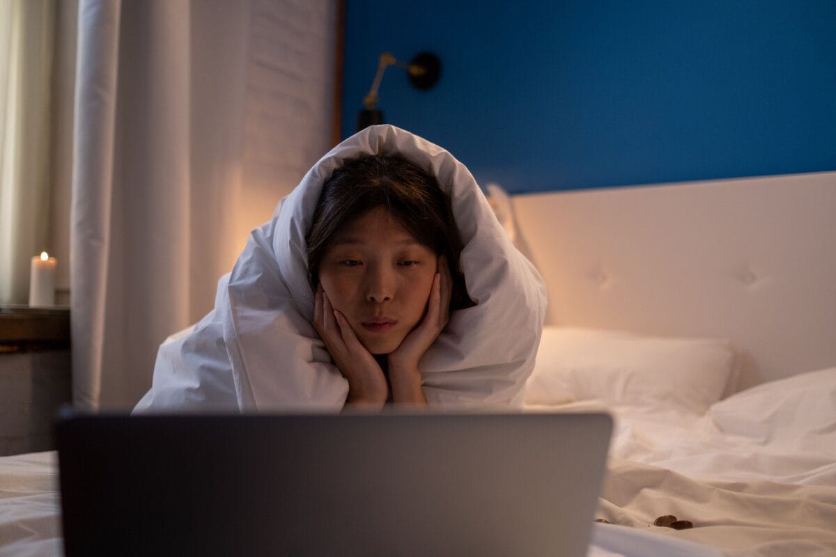 Person watching a show on a laptop